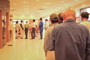 People waiting, long line at government office